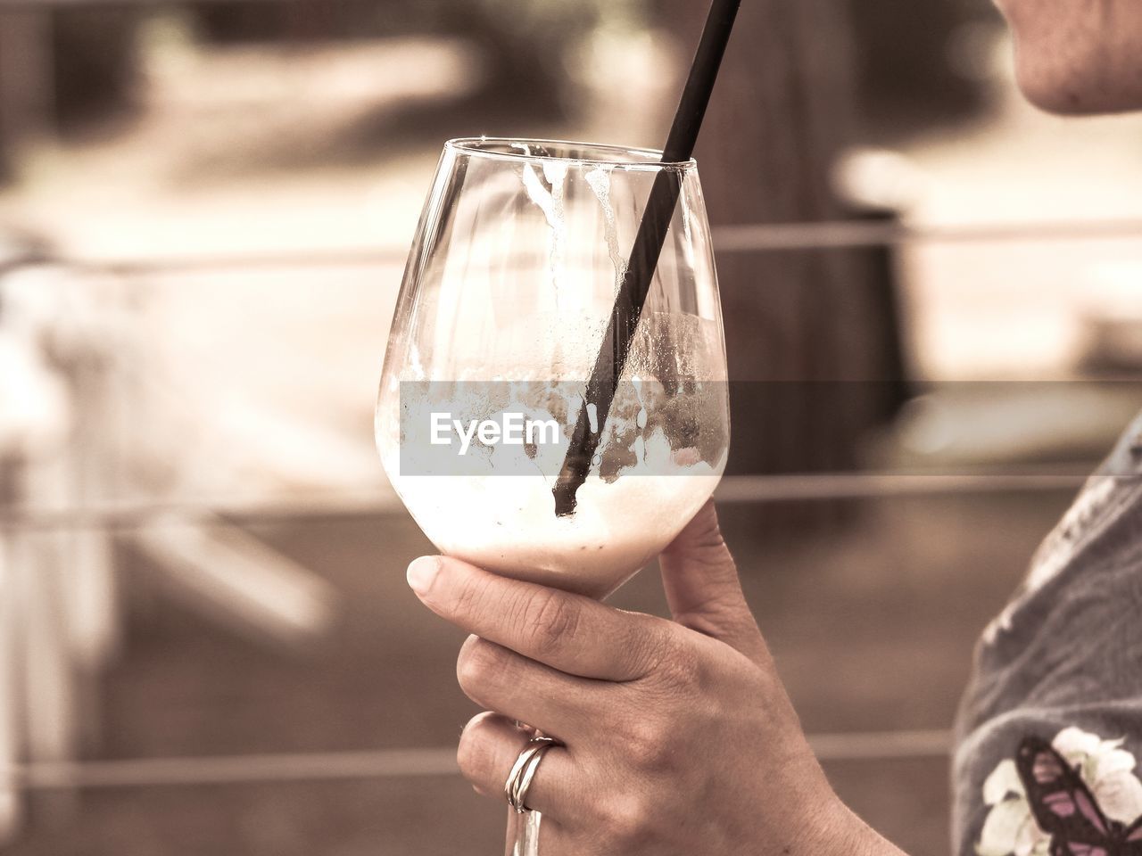 Cropped image of woman holding wineglass