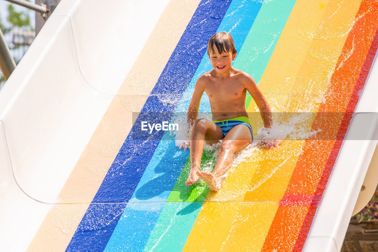 BOY IN SWIMMING POOL