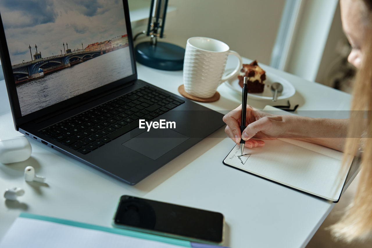 Woman working at home office, use laptop