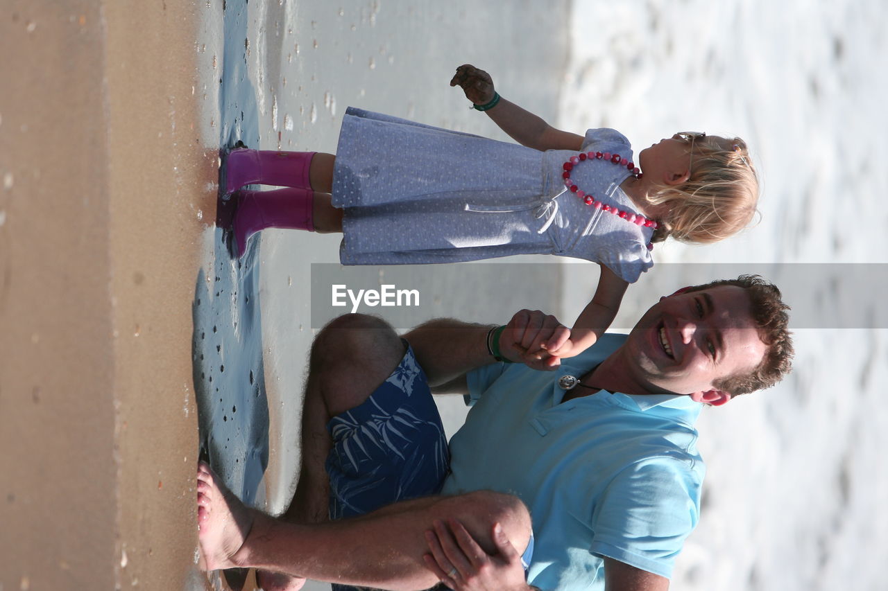 TWO PEOPLE ON BEACH