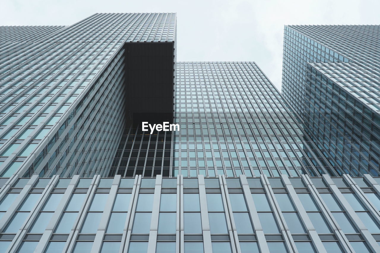 Low angle view of modern building against sky in city