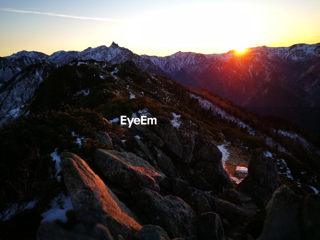 Scenic view of mountains against sky during sunset