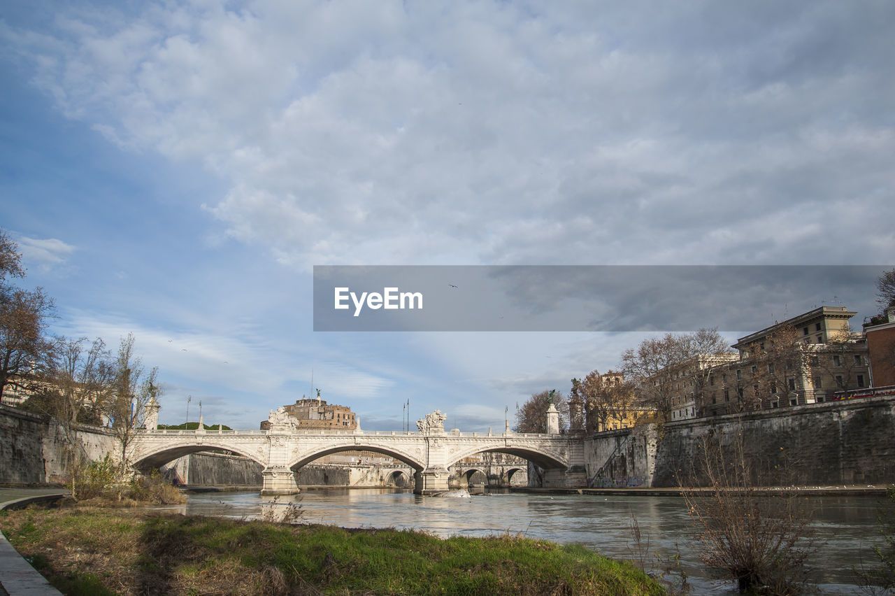 ARCH BRIDGE OVER RIVER AGAINST SKY