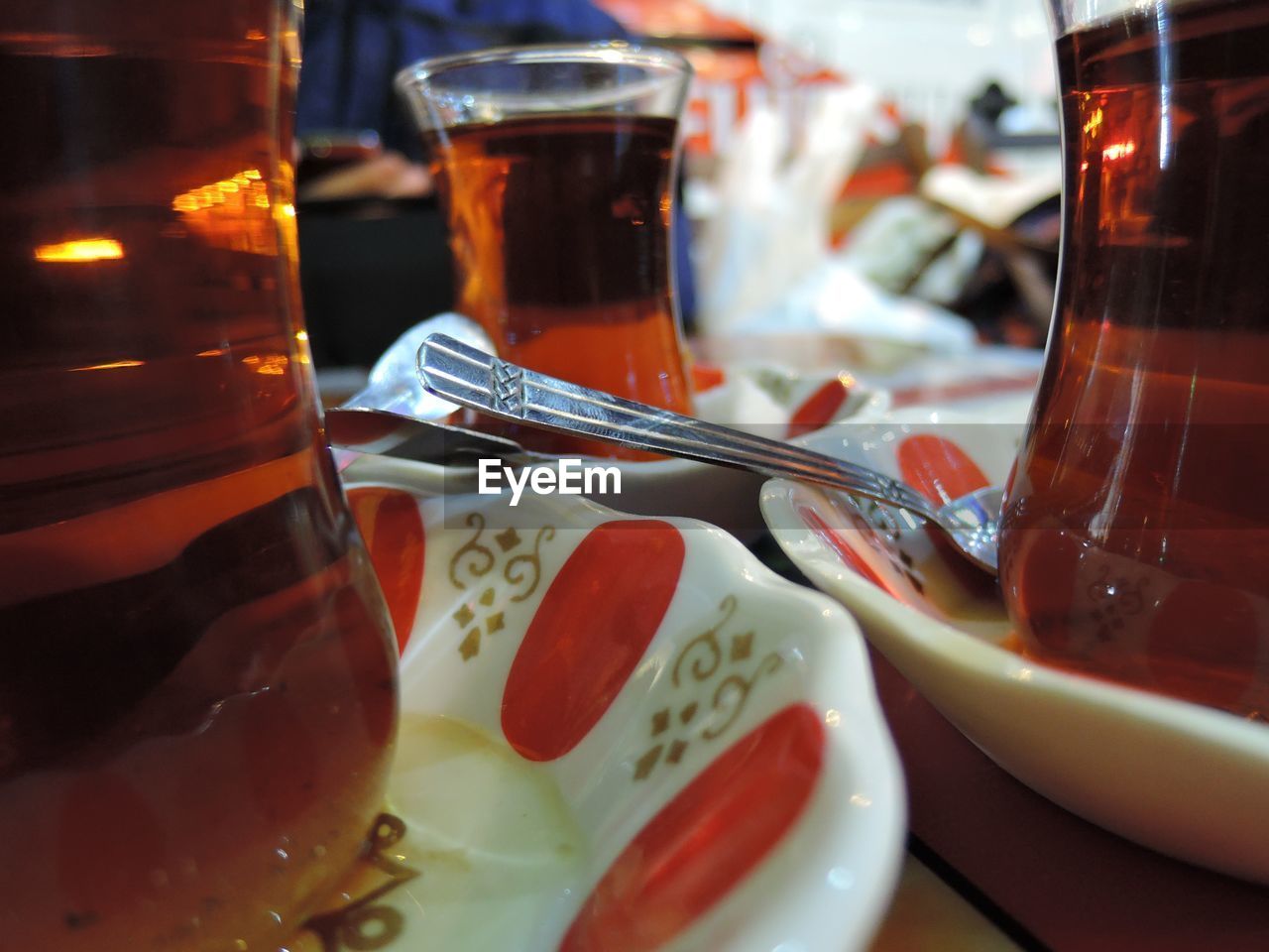 CLOSE-UP OF DRINKS IN JAR ON TABLE