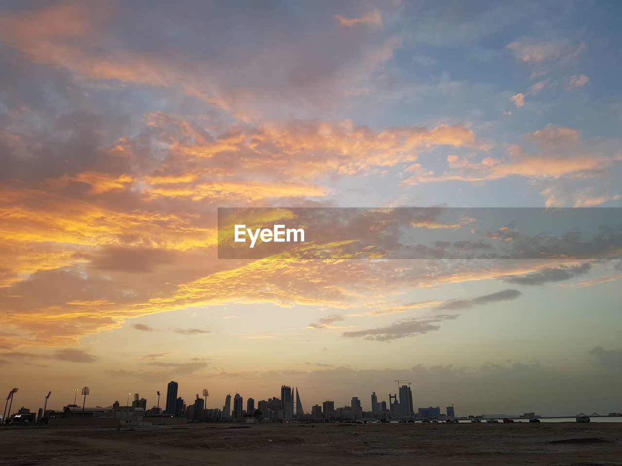 Silhouette buildings against sky during sunset