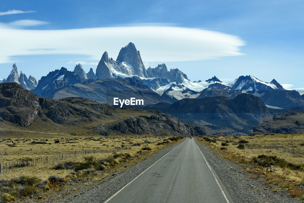 Road amidst mountains against sky fitz roy el chalten patagonia argentina