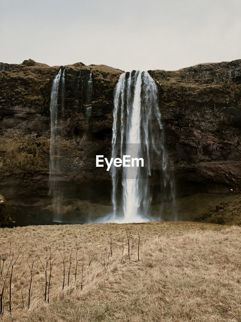 waterfall, water, scenics - nature, environment, rock, motion, body of water, nature, beauty in nature, land, long exposure, landscape, terrain, water feature, sky, travel destinations, cliff, travel, no people, power in nature, flowing water, outdoors, non-urban scene, sea, tourism, rock formation, splashing, blurred motion, plant, flowing, formation, geology, mountain, coast, day
