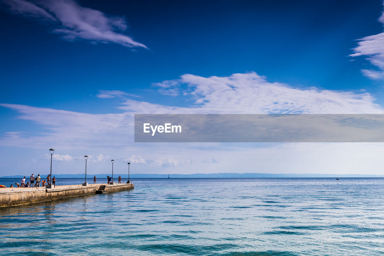 Scenic view of sea against blue sky