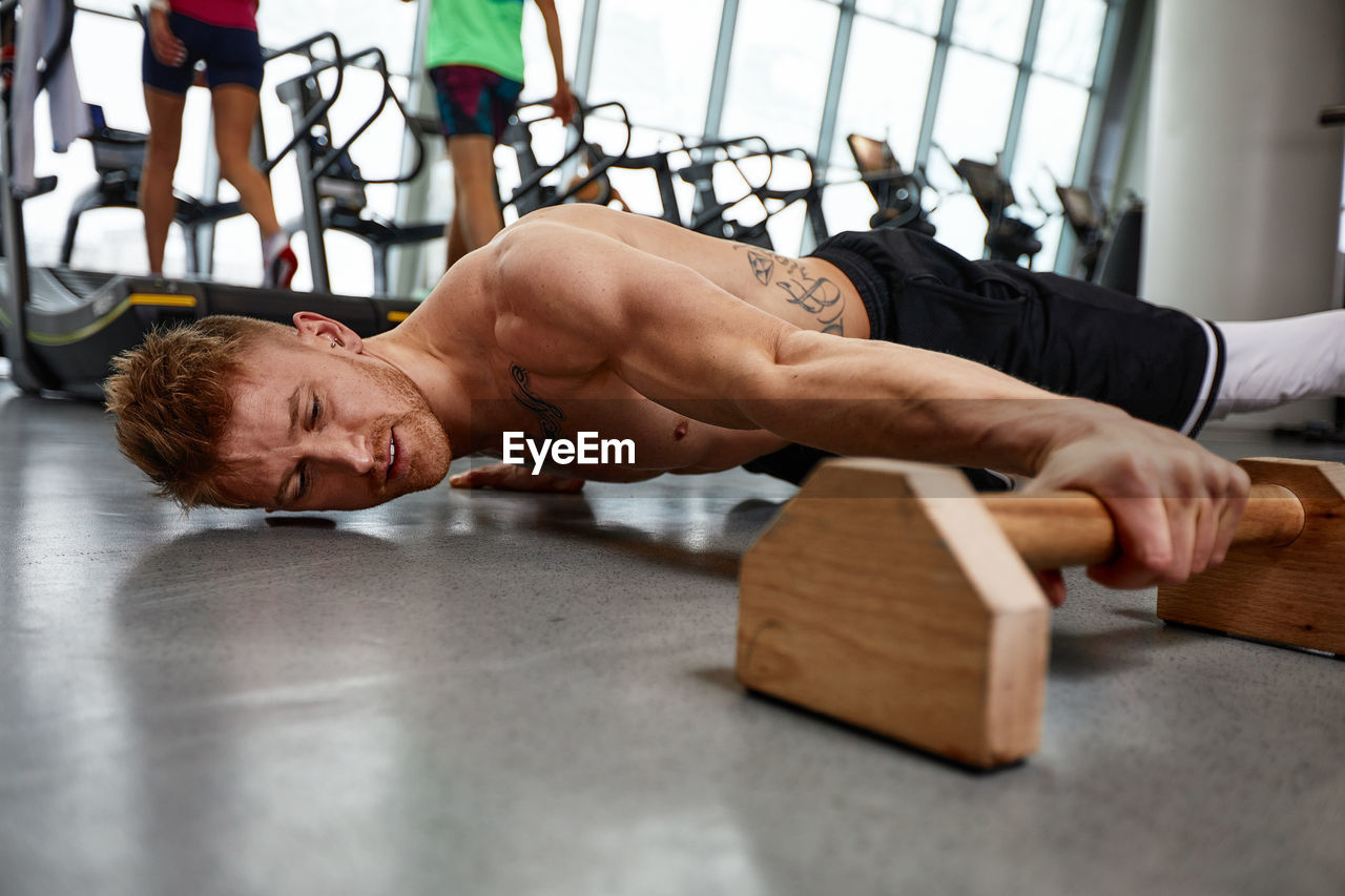 high angle view of man exercising on table