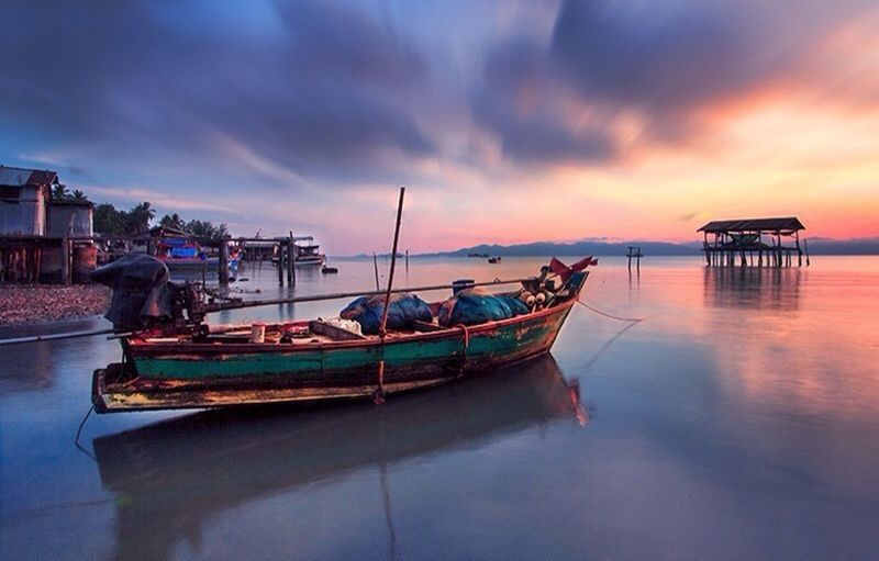 SCENIC VIEW OF SEA AT SUNSET