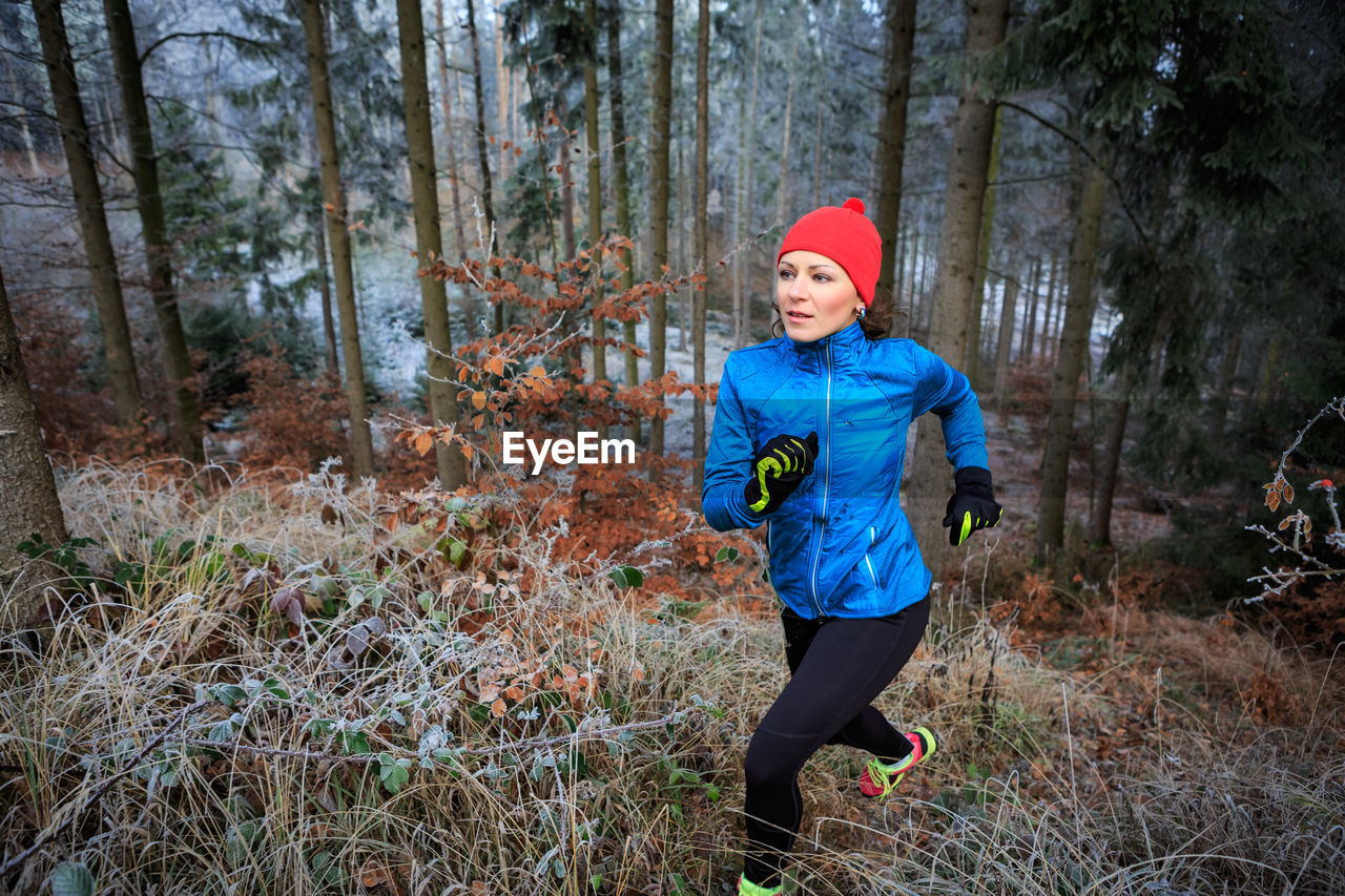 Woman jogging in forest