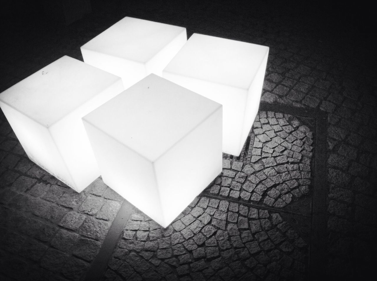 High angle view of illuminated cubes on footpath