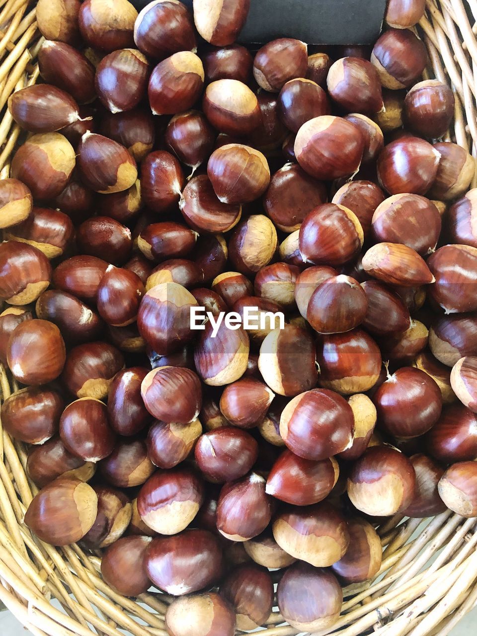 High angle view of chestnuts in basket