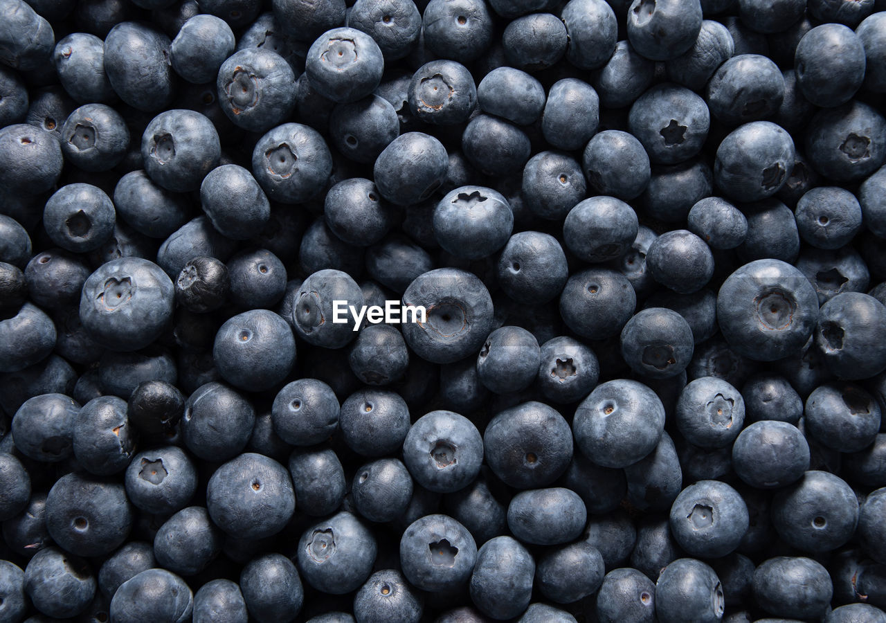 Big box with scattered fresh blueberries, fresh raw food, natural healthy food