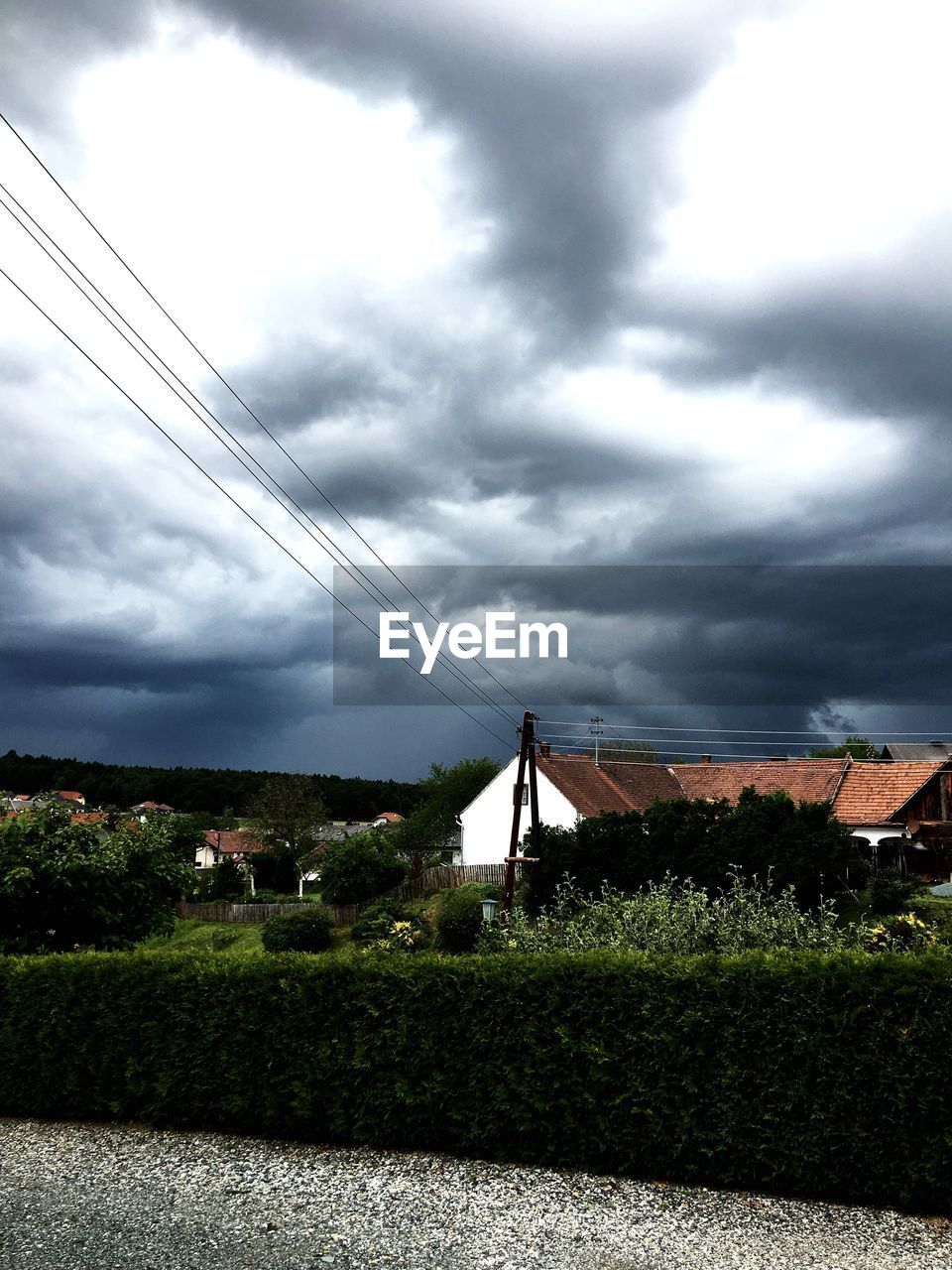 VIEW OF FIELD AGAINST CLOUDY SKY AT DUSK