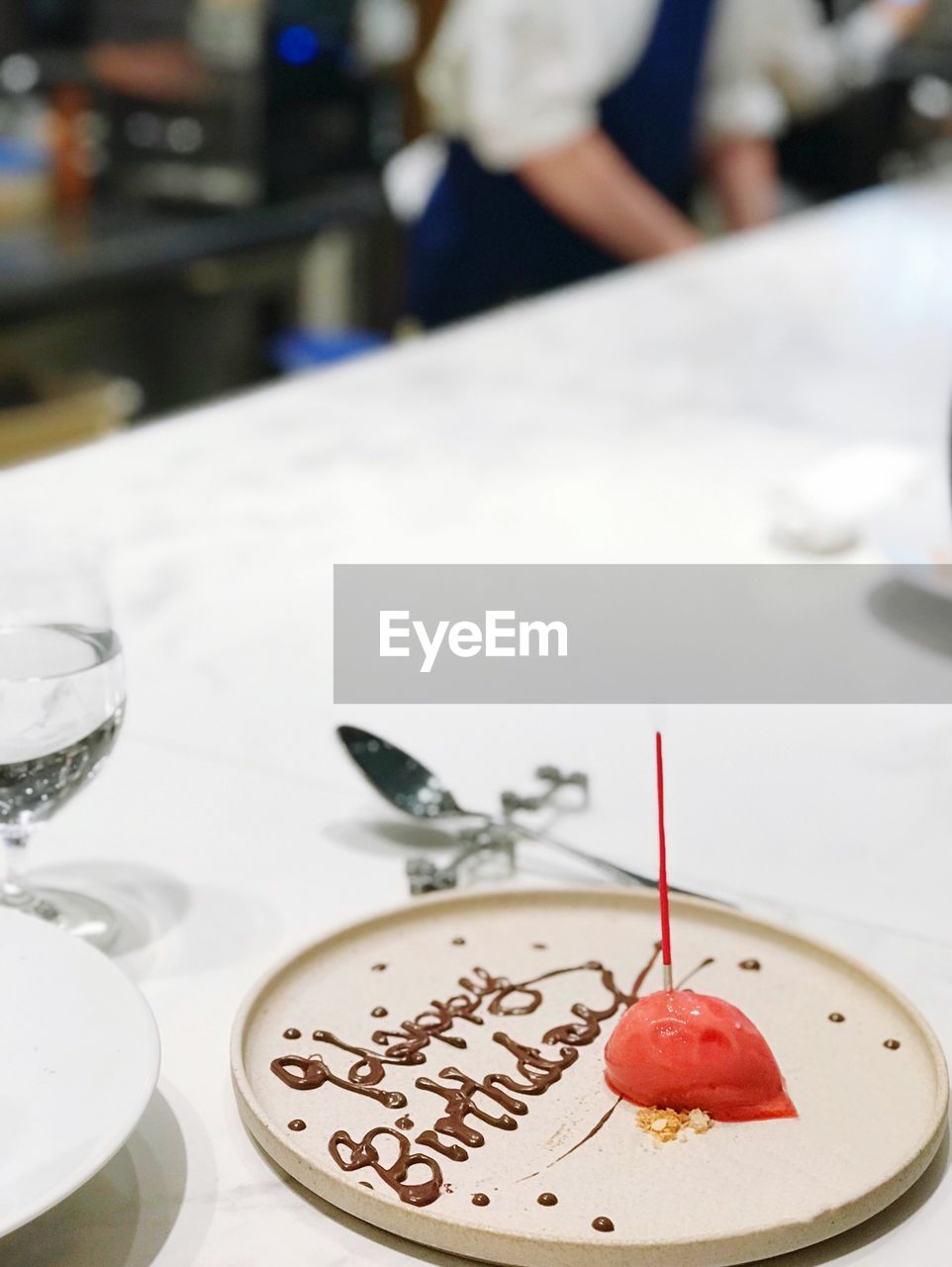 Close-up of birthday dessert served on table