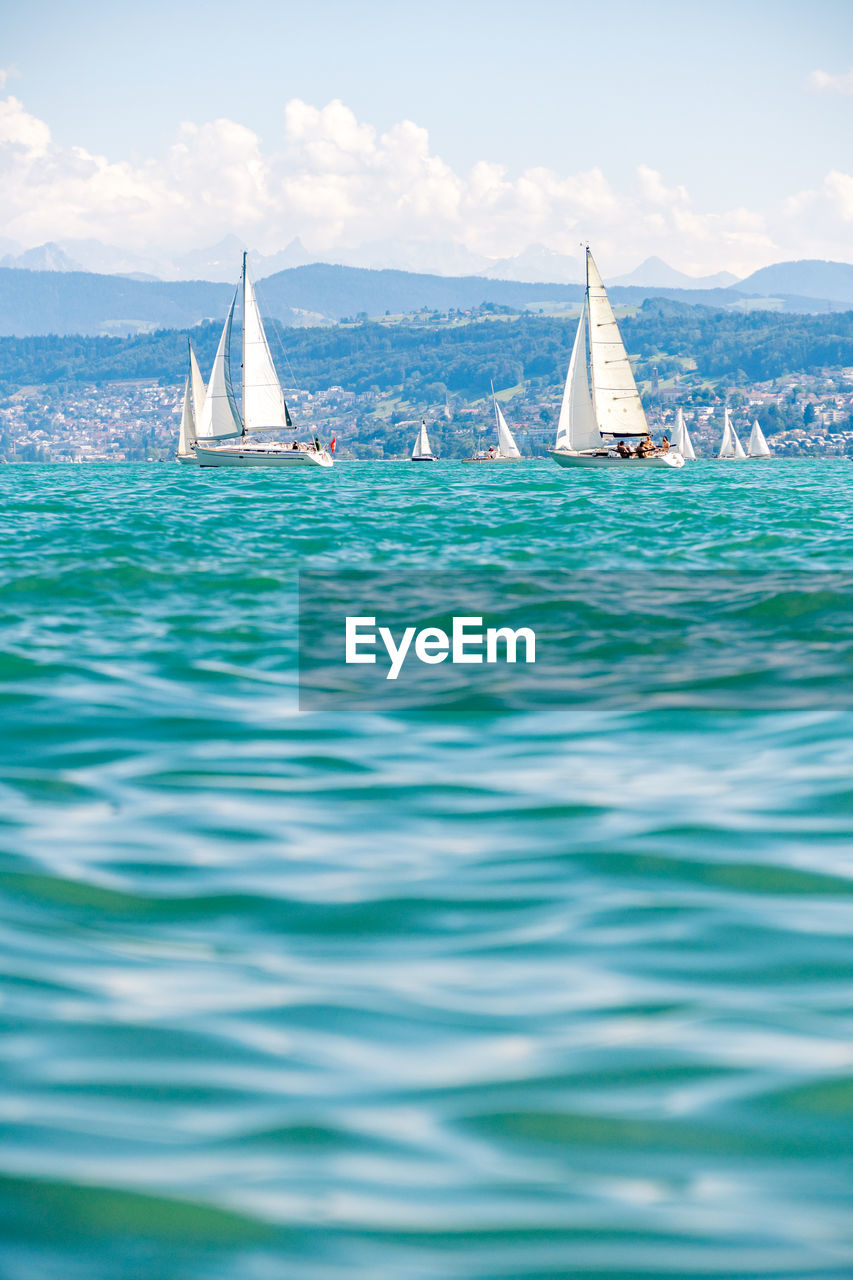 Sailboats on beautiful lake zürich zürichsee in switzerland.