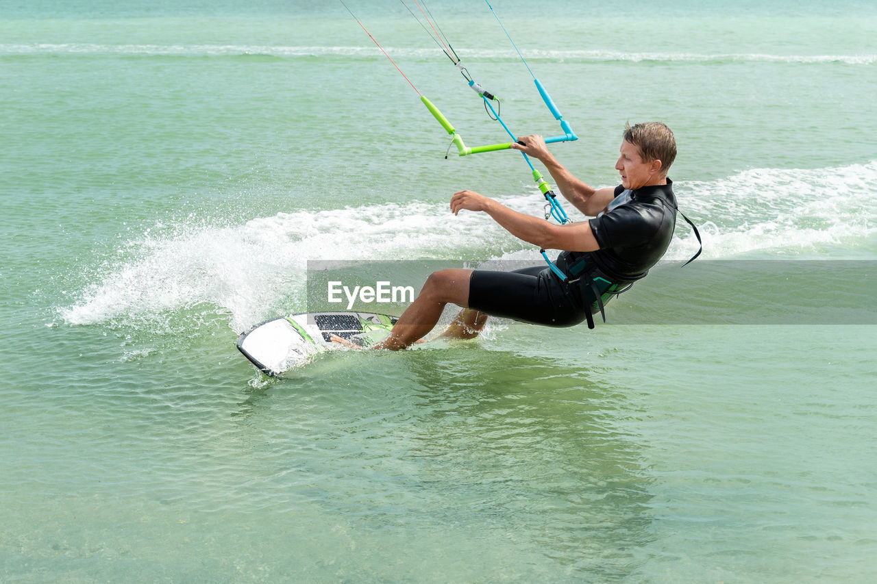 Full length of man surfing in sea