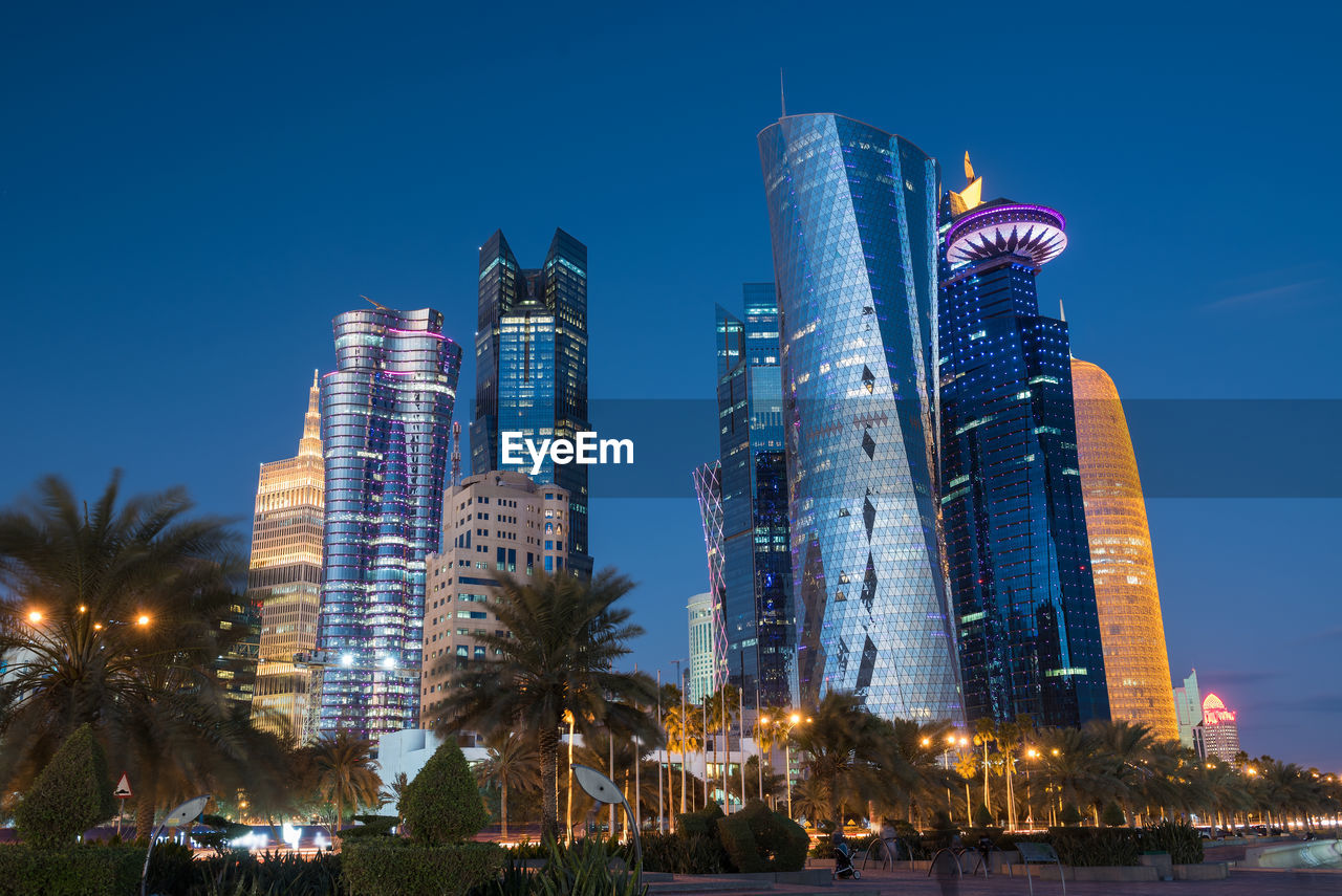 LOW ANGLE VIEW OF BUILDINGS AT NIGHT