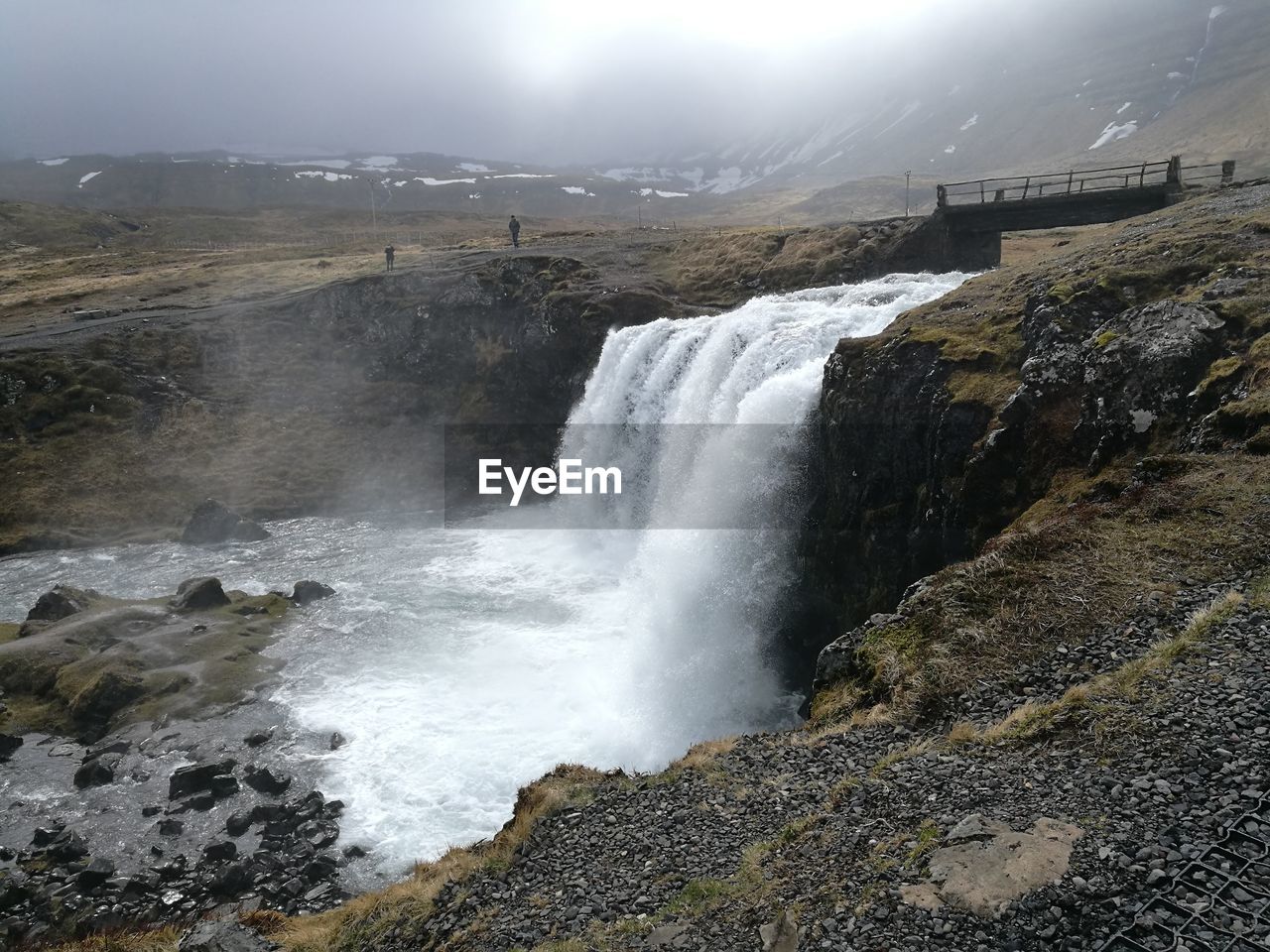 VIEW OF WATERFALL AGAINST THE SKY