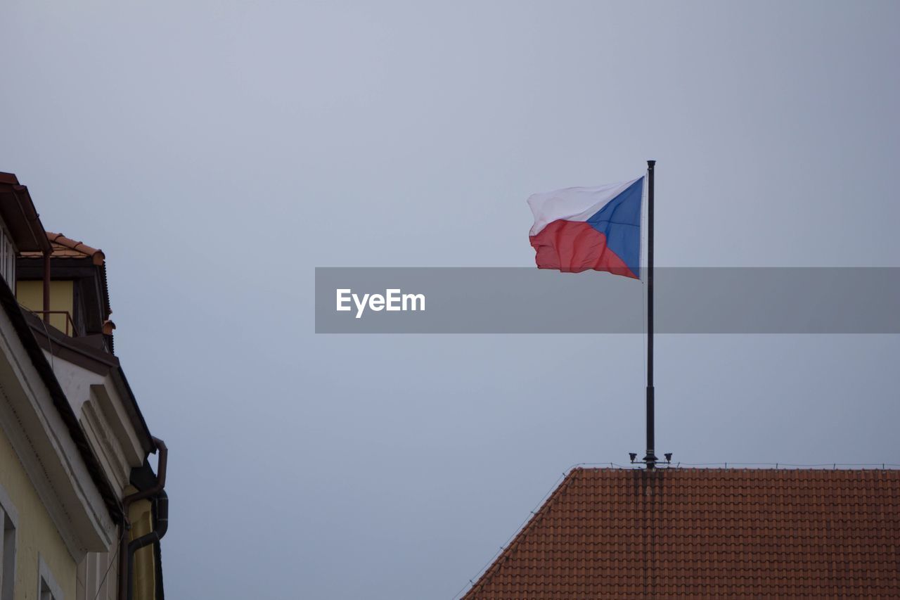 LOW ANGLE VIEW OF FLAG FLAGS AGAINST CLEAR SKY