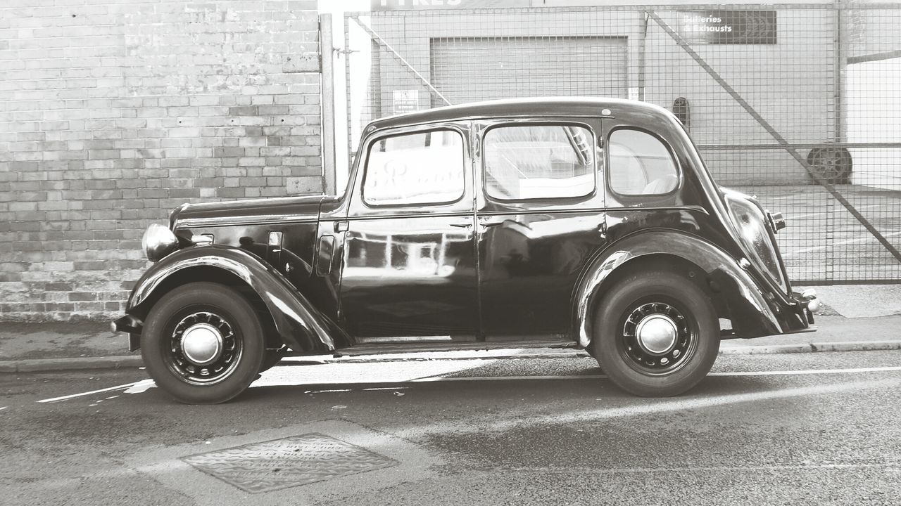 VIEW OF CAR ON ROAD