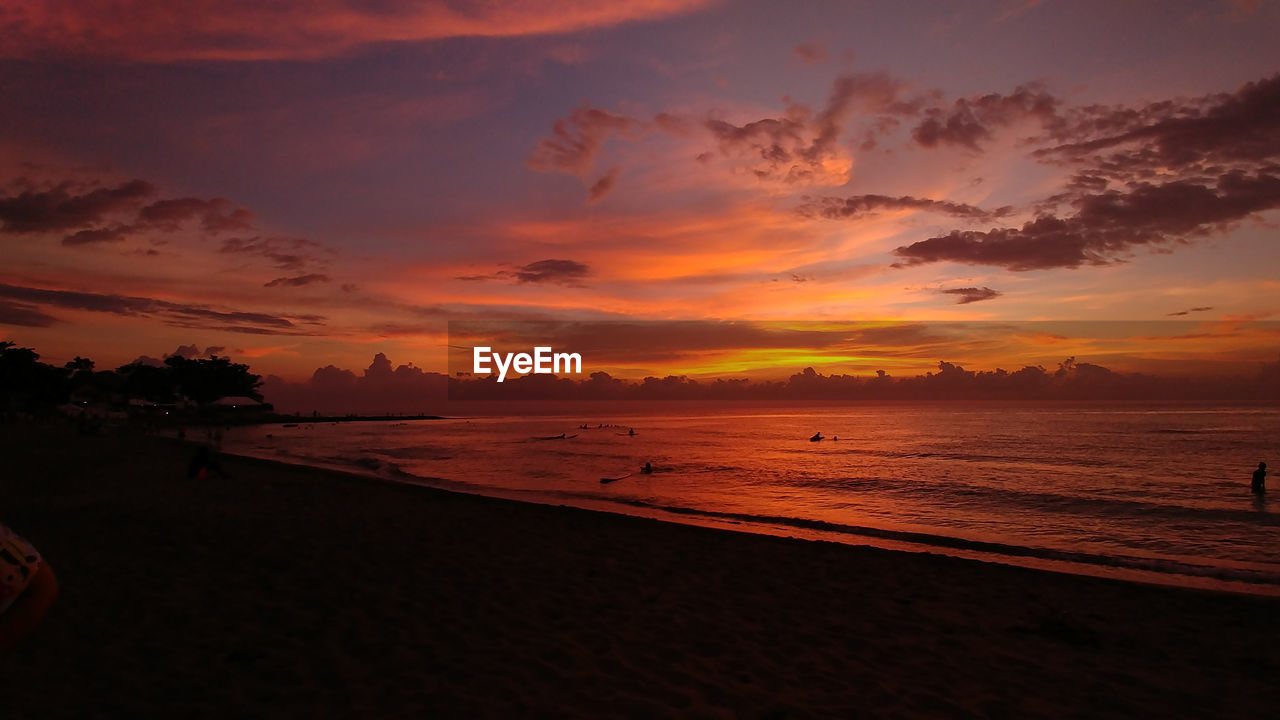 Scenic view of beach against sky during sunset