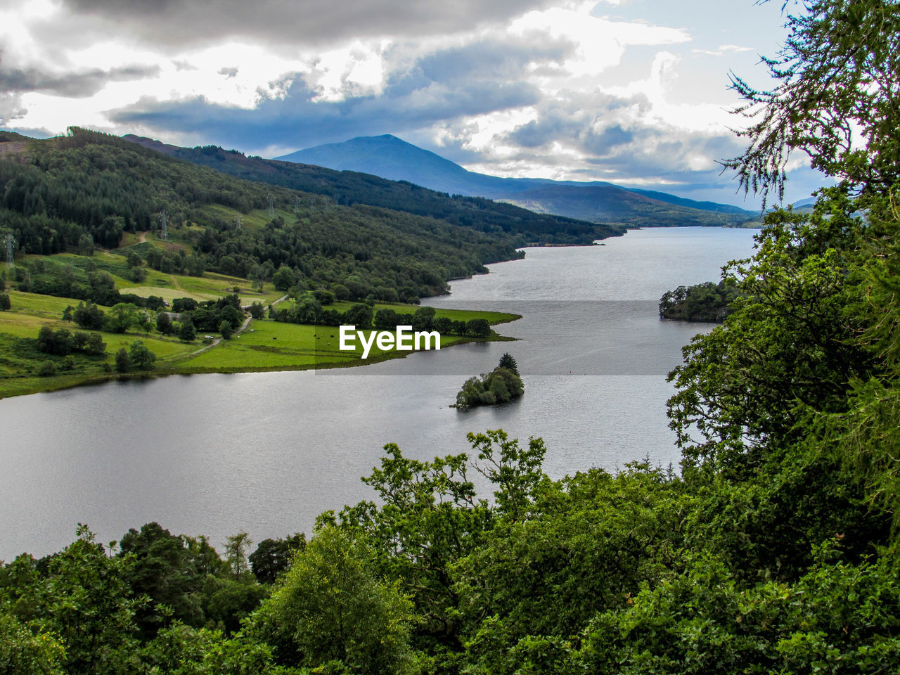 High angle view of lake against cloudy sky