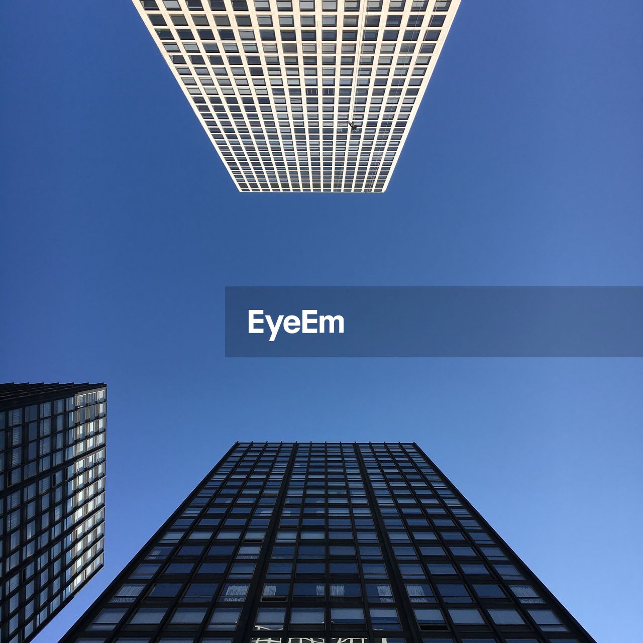 LOW ANGLE VIEW OF OFFICE BUILDING AGAINST SKY