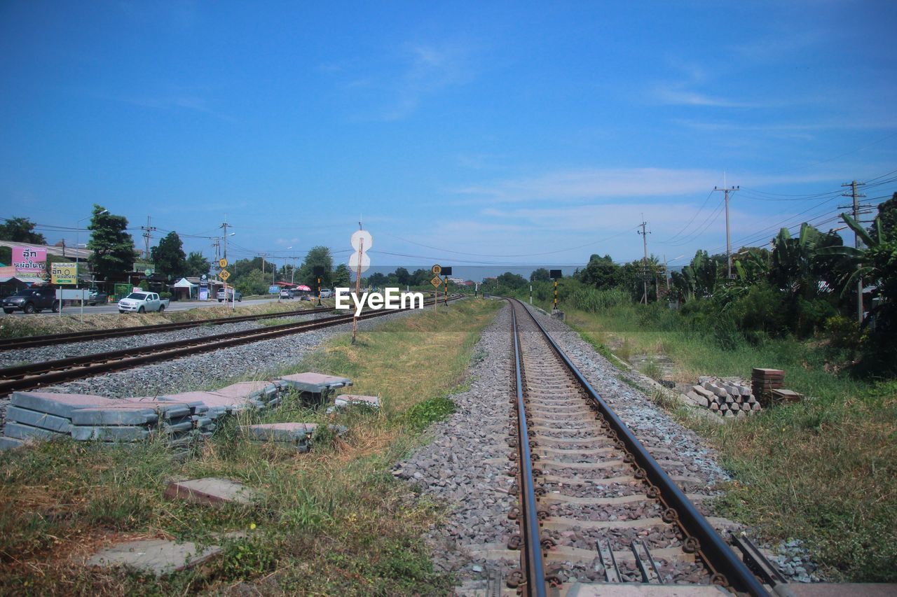 Railway tracks against blue sky