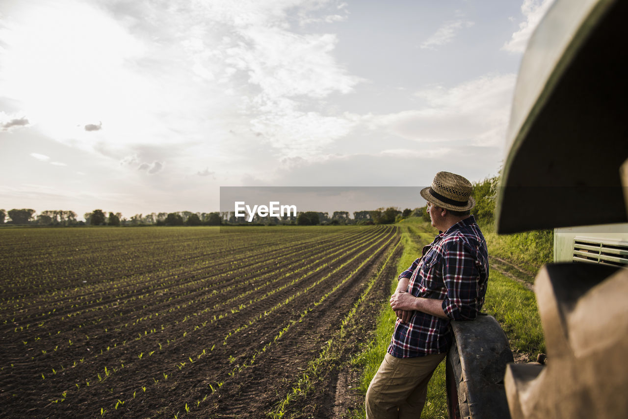 Farmer standing at a field
