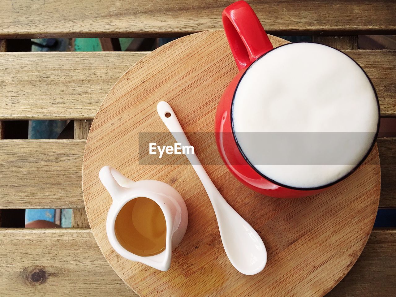 High angle view of coffee on cutting board over table
