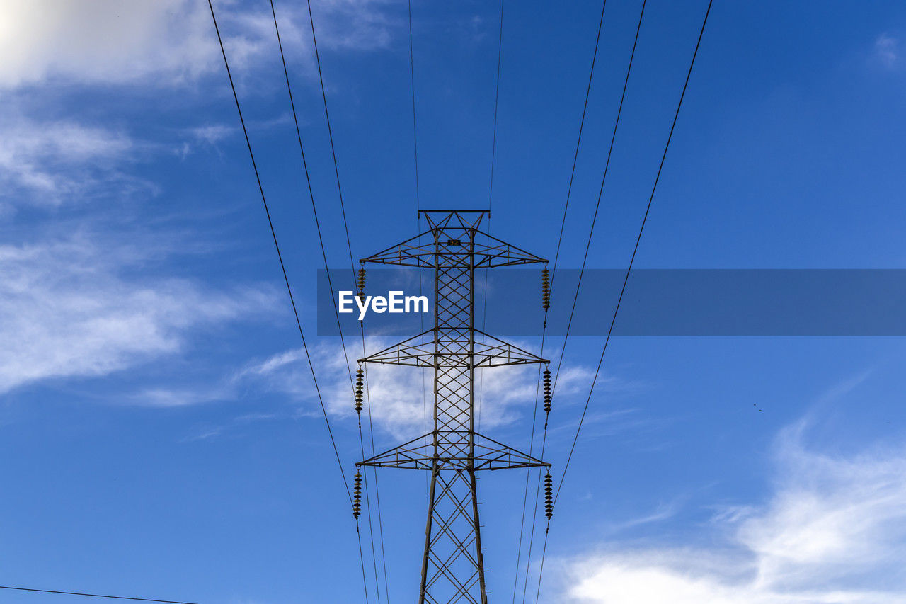 High voltage towers against blue sky background in brazil