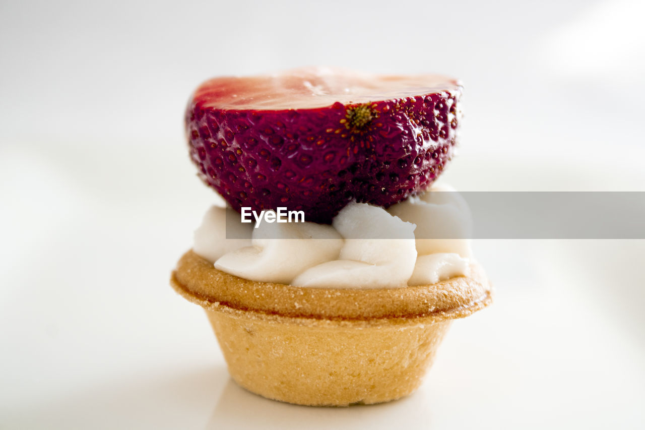 Close-up of dessert against white background