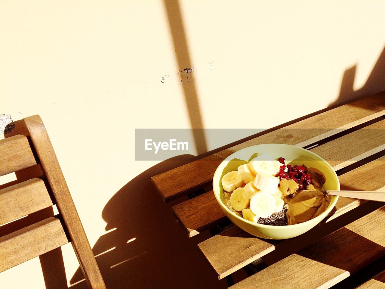 High angle view of breakfast cereal in bowl on sunny day