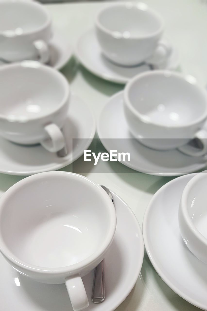 High angle view of empty coffee cups on table