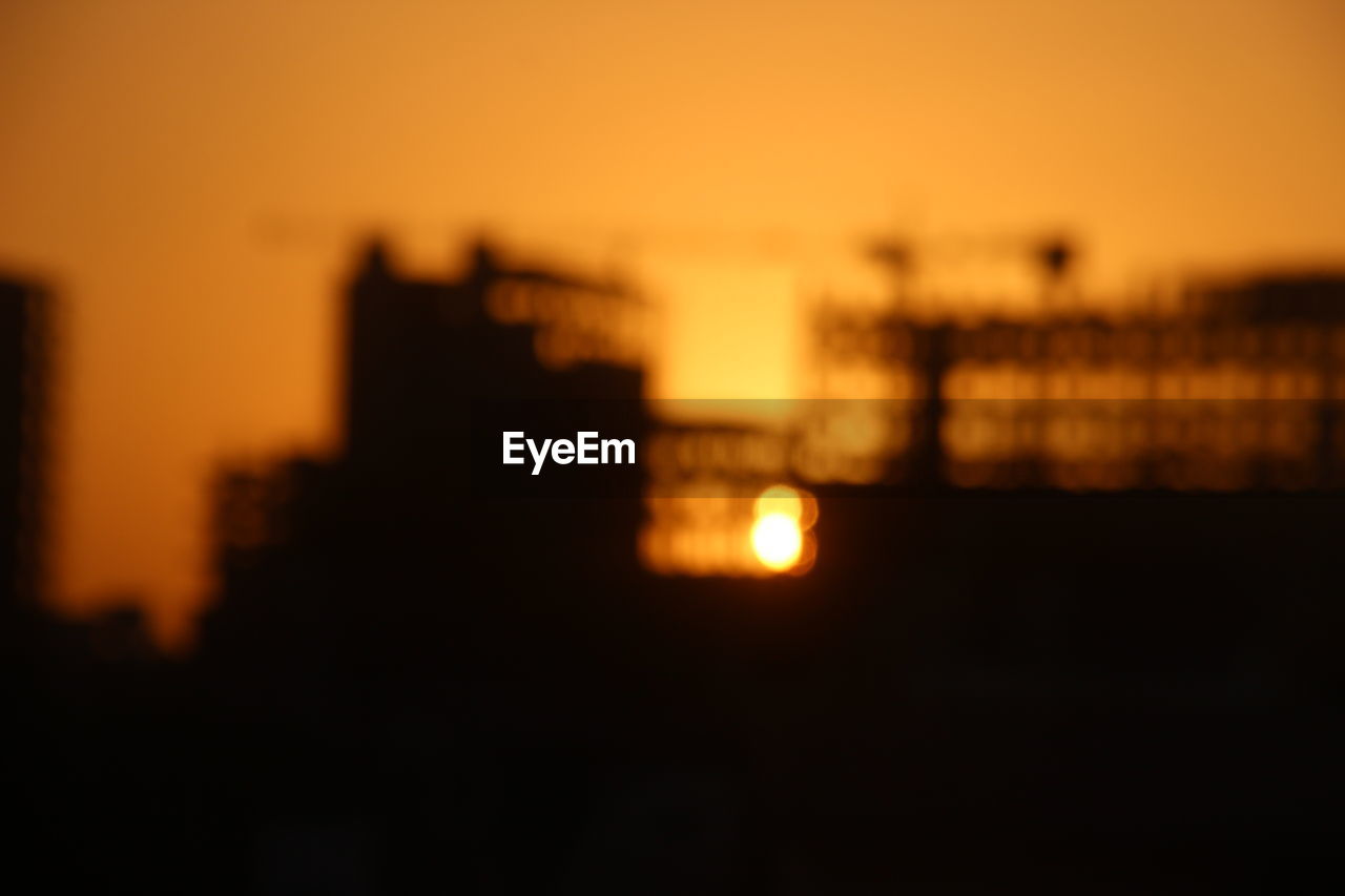 SILHOUETTE OF CITY AT NIGHT