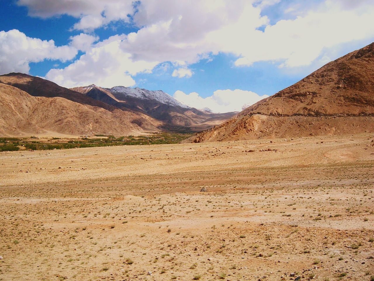 Landscape and rocky mountains against sky