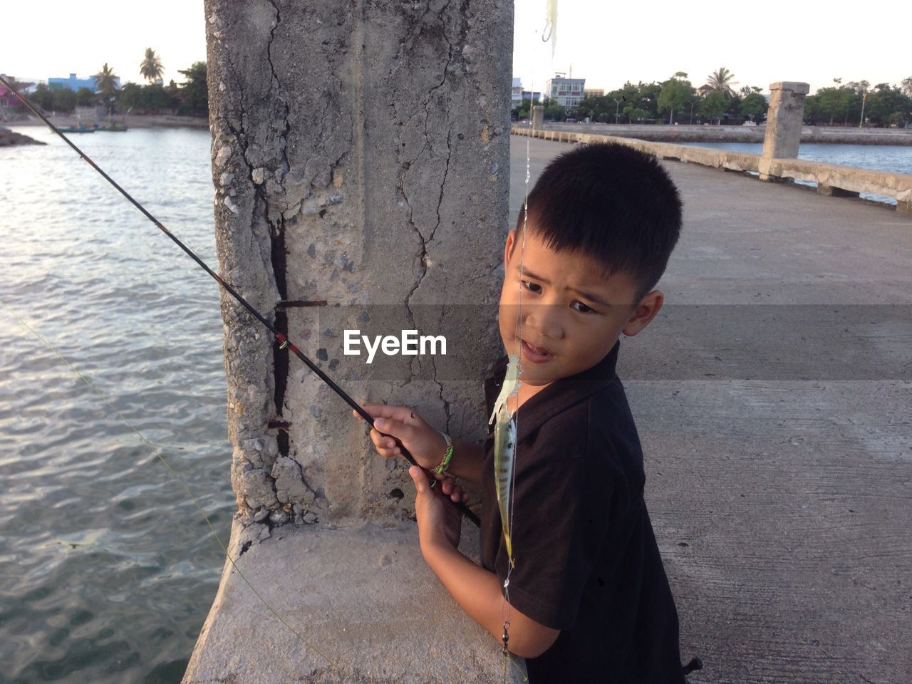 Boy fishing in river