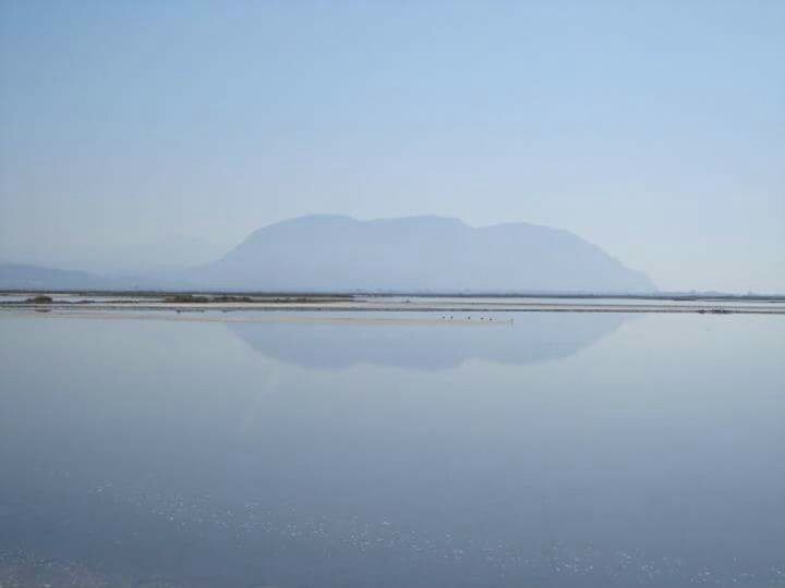 SCENIC VIEW OF LAKE AND MOUNTAINS