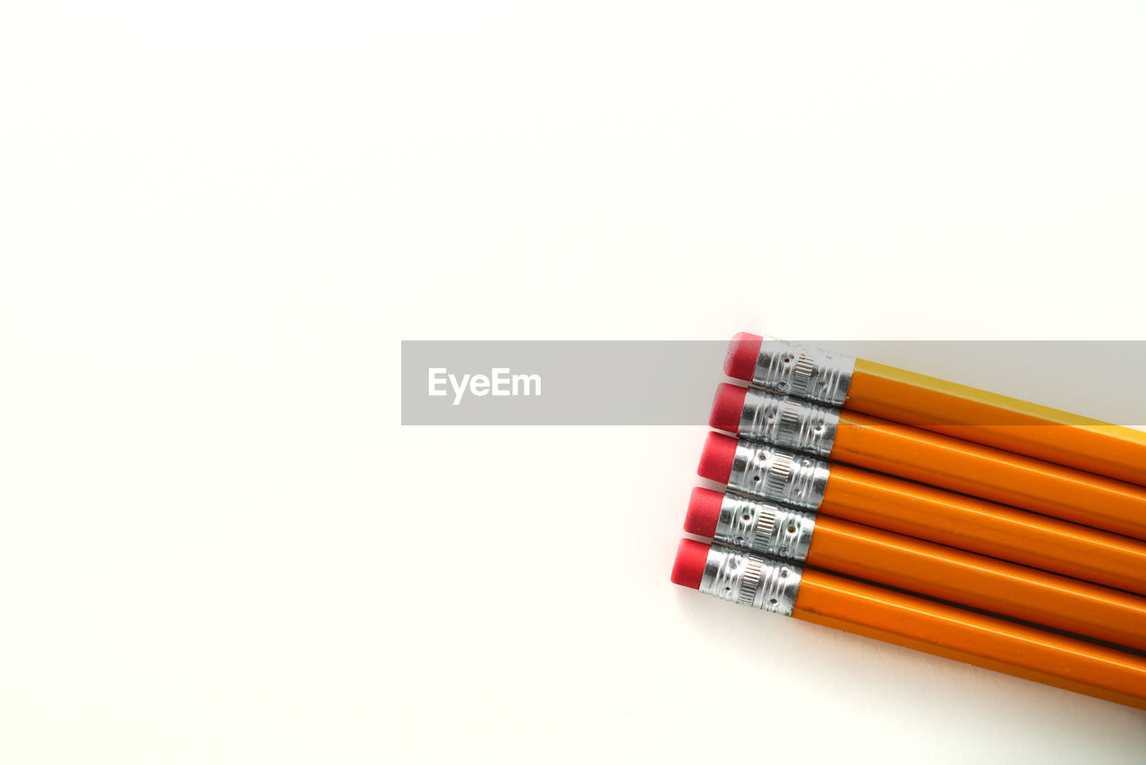 Directly above shot of pencils on white background