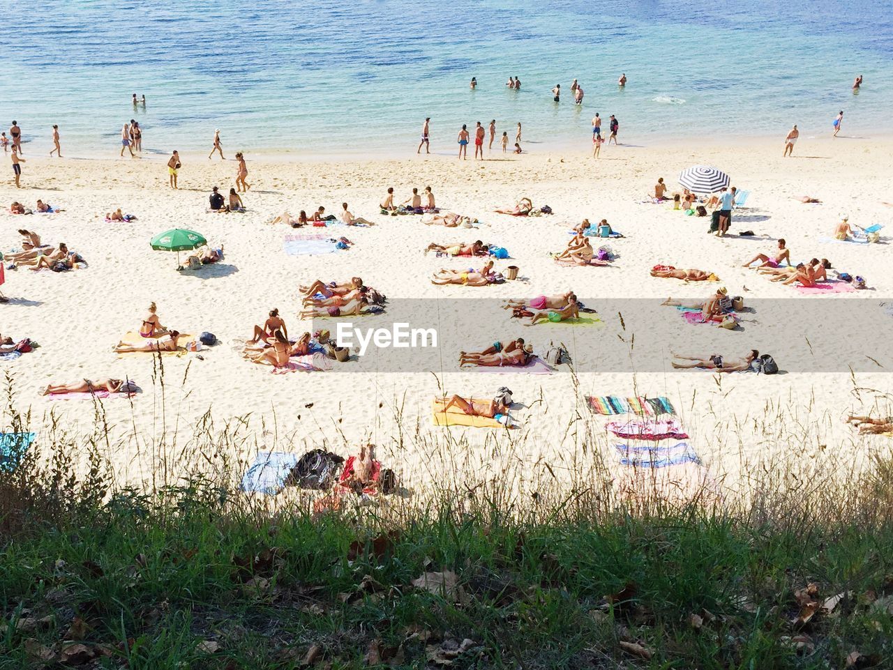 High angle view of people relaxing on beach