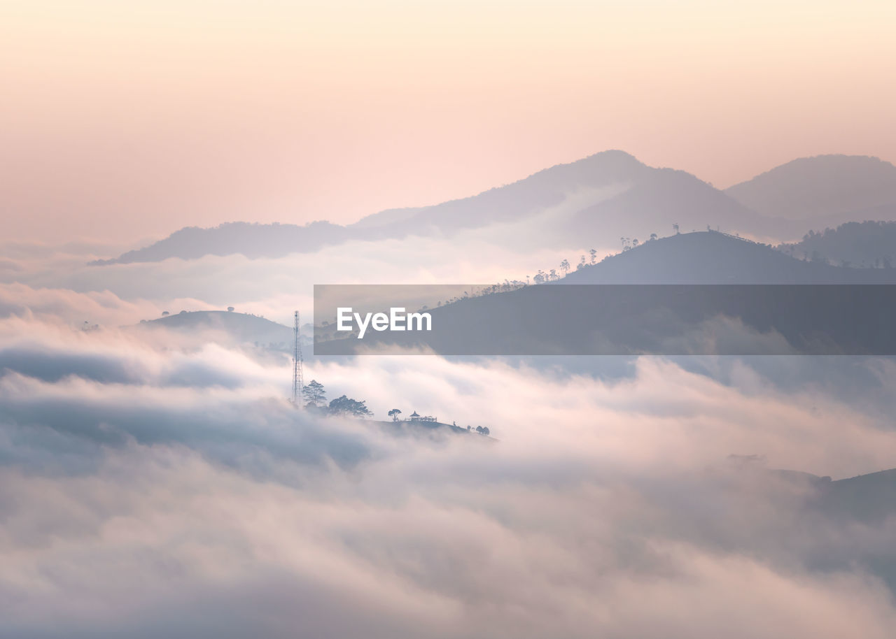 Low angle view of mountains against sky during sunset