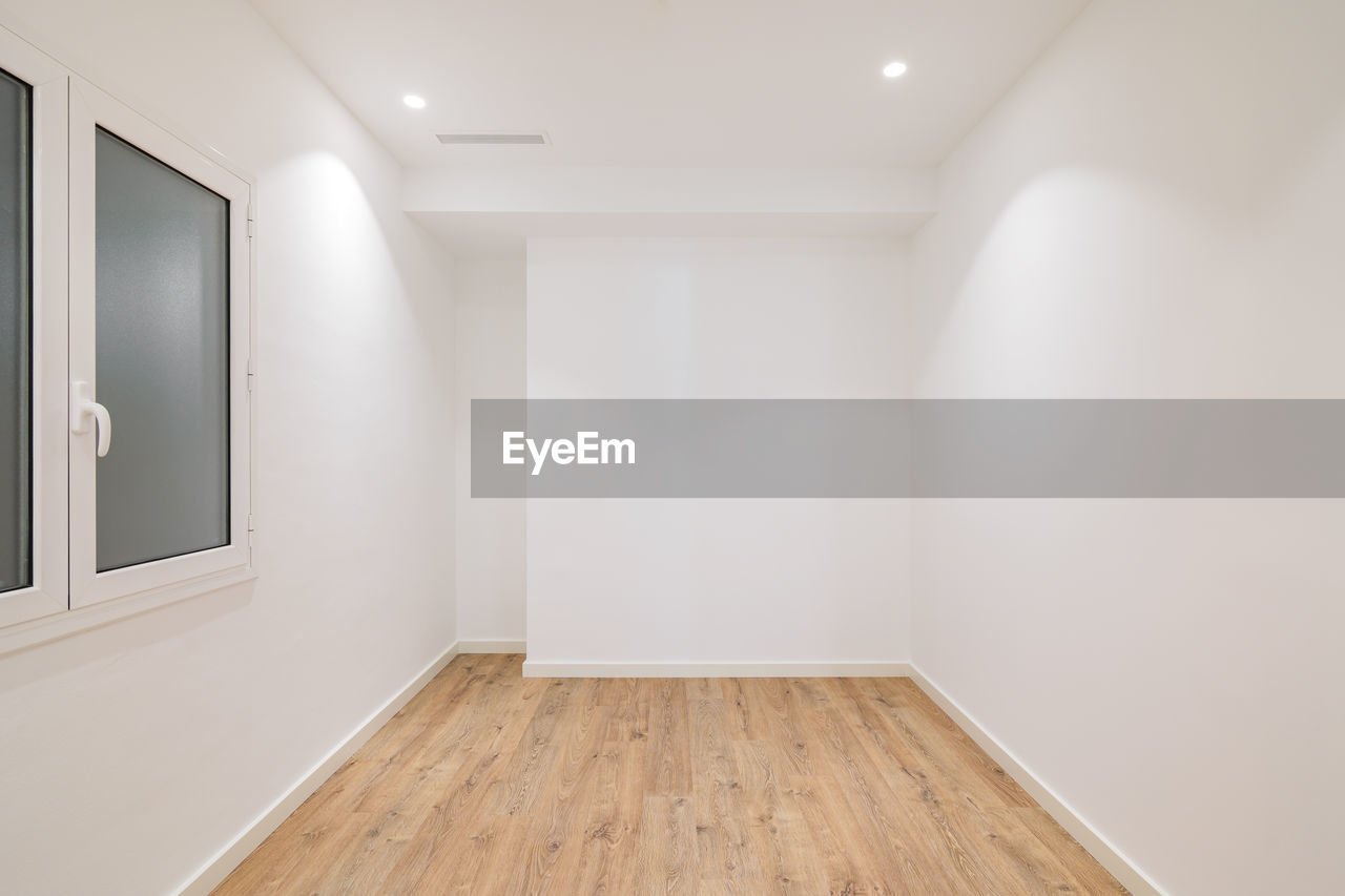 Empty apartment room with wooden floor in a new flat for rent