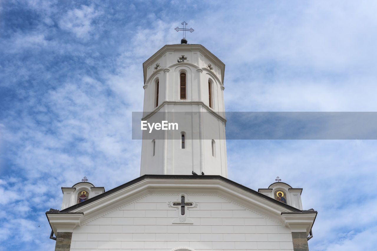 architecture, building exterior, built structure, sky, building, religion, place of worship, steeple, belief, cloud, tower, spirituality, no people, low angle view, nature, bell tower, day, blue, cross, history, travel destinations, outdoors, the past, white, catholicism, clock, time, travel