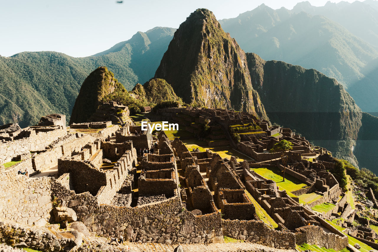 Machu picchu old inca ruins at sunrise in peru