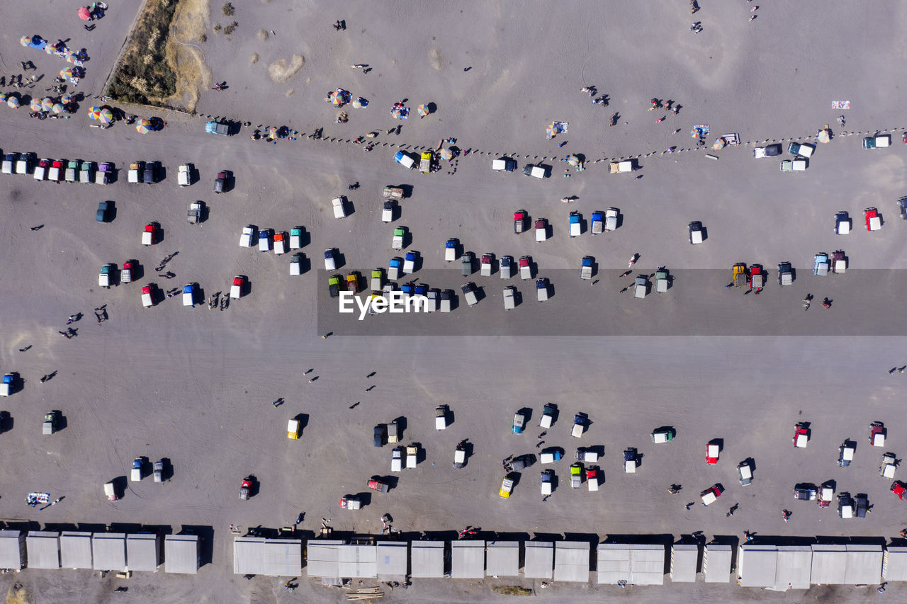 Aerial view of cars on road at sunny day