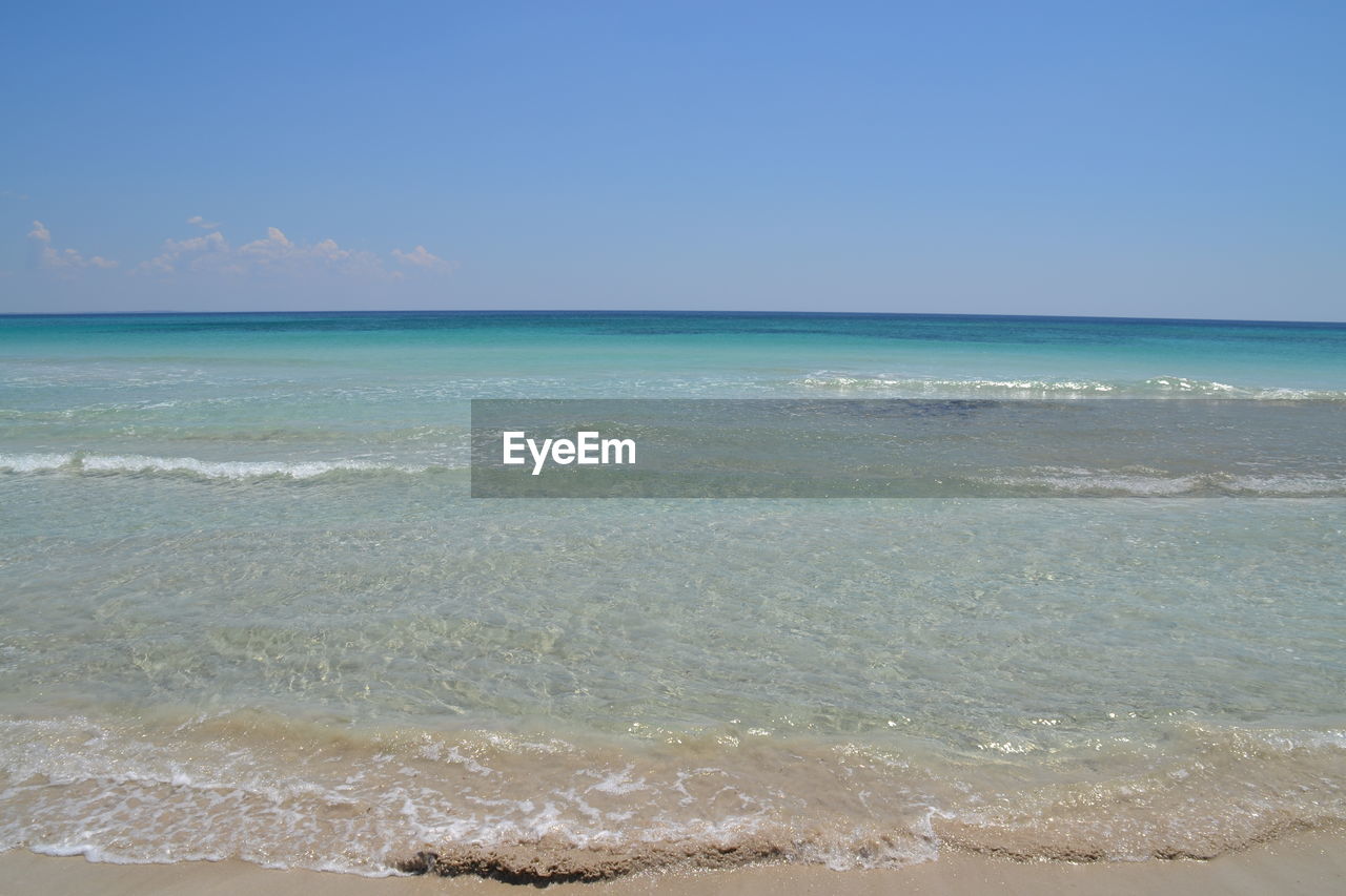 Scenic view of sea against clear blue sky