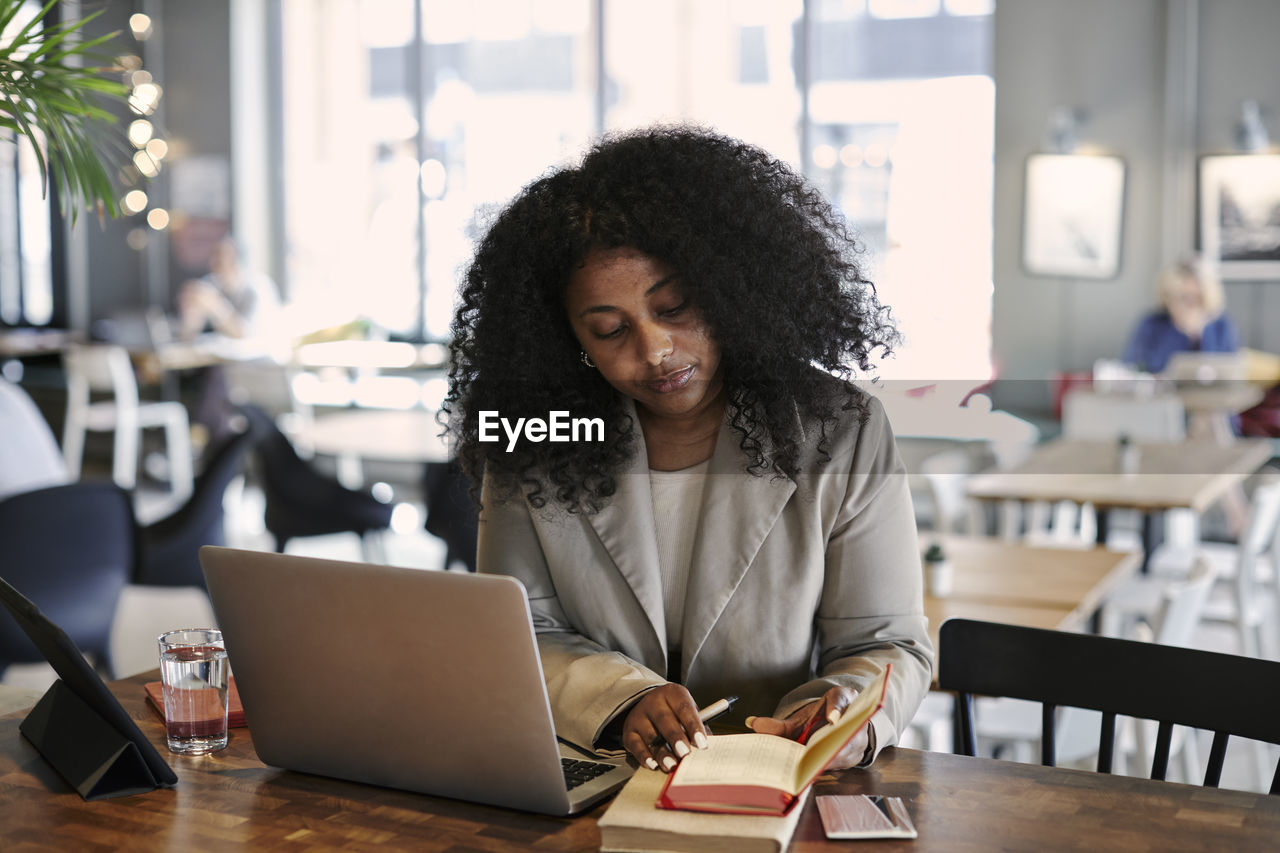 Woman working in cafe