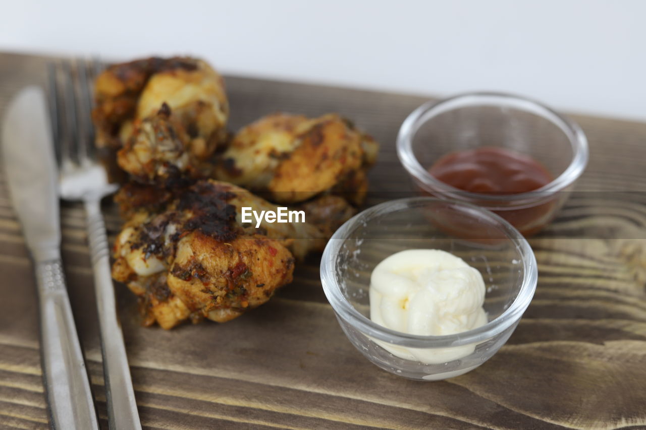 food and drink, food, dish, freshness, breakfast, healthy eating, dessert, produce, meal, wellbeing, indoors, baked, no people, fried food, close-up, studio shot, wood, table, meat, vegetable, cuisine, bowl, fritter, focus on foreground, household equipment